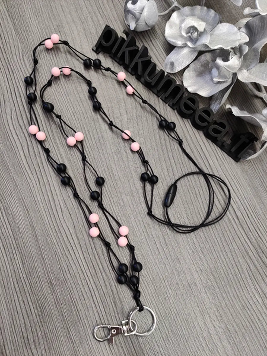 Avainnauha olan yli (musta / vaaleanpunainen)