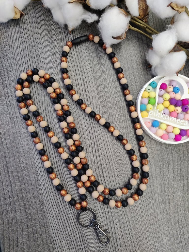 Avainnauha olan yli (beige / kupari / musta) - pikkumeea