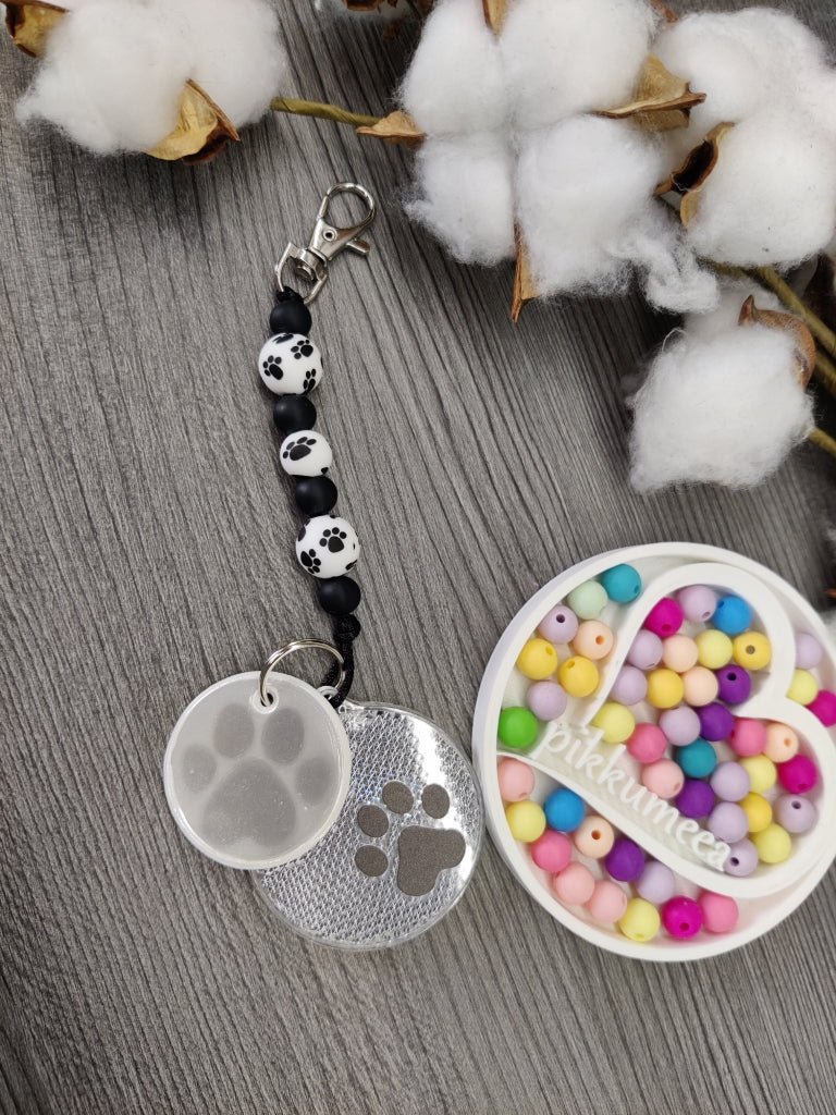 Heijastin tassu (musta / valkoinen) - pikkumeea