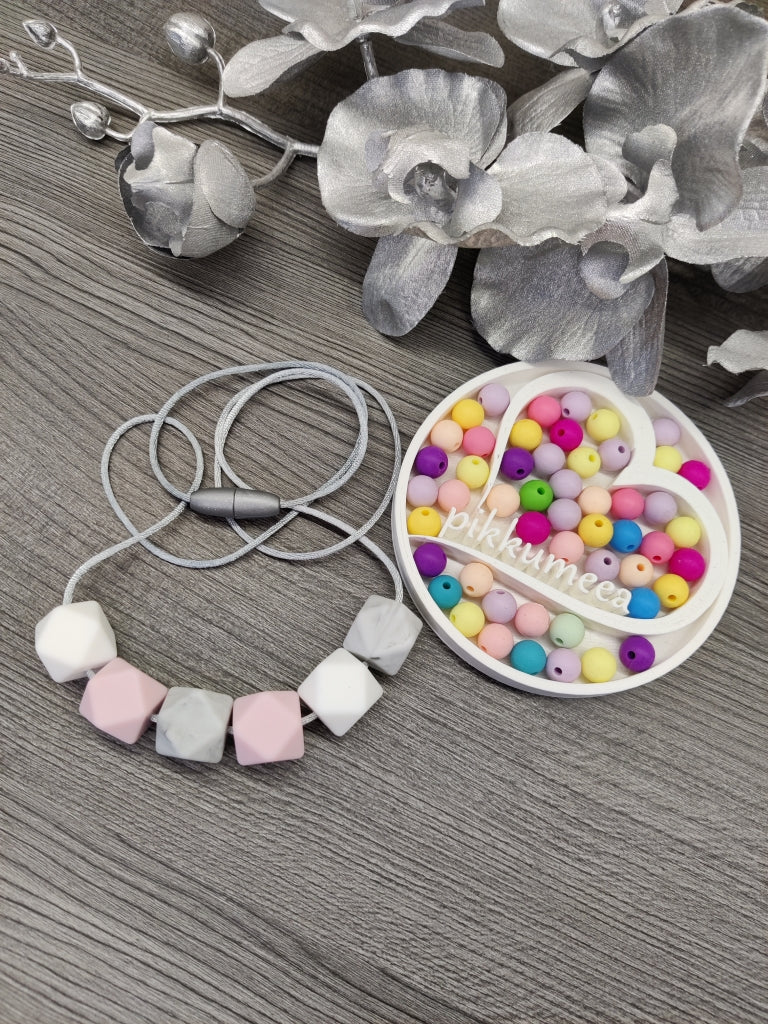 Imetys-/kantokoru (harmaa marmori / vaaleanpunainen / valkoinen)