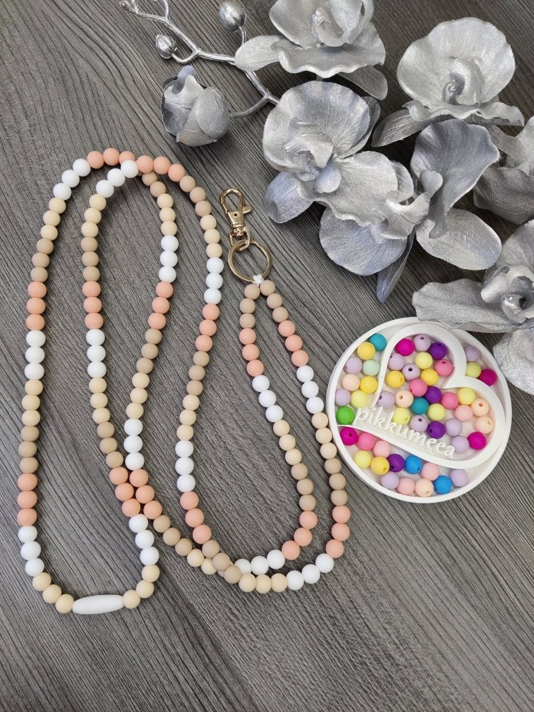 Avainnauha olan yli (valkoinen / beige / persikka / vaalea beige) - pikkumeea