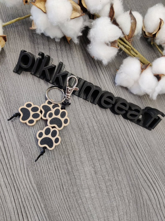 Avaimenperä Tassu (beige / musta) - pikkumeea