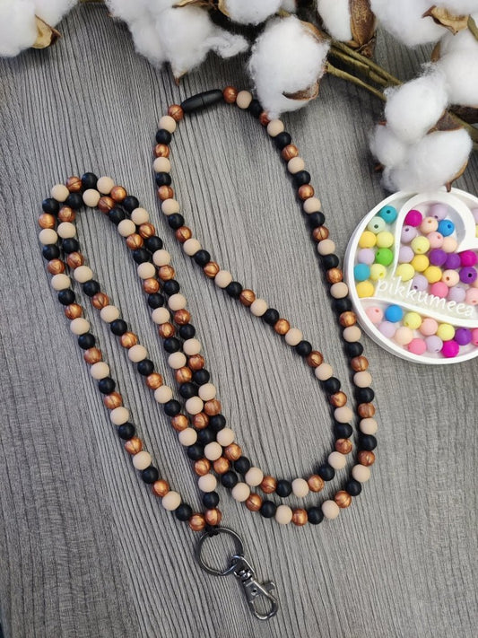 Avainnauha olan yli (beige / kupari / musta) - pikkumeea