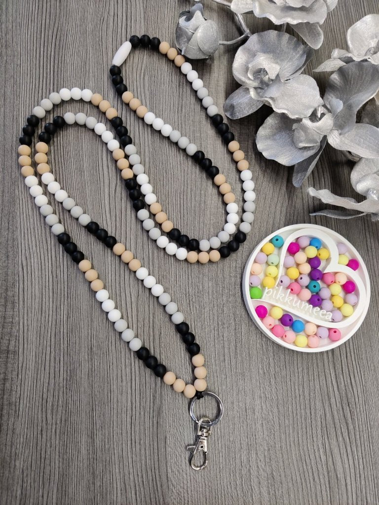 Avainnauha olan yli (beige / musta / vaaleanharmaa / valkoinen) - pikkumeea