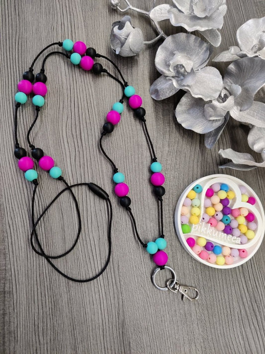 Avainnauha olan yli (fuksia / turkoosi / musta) - pikkumeea