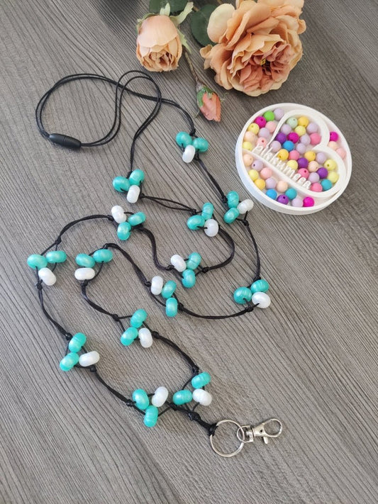 Avainnauha olan yli (helmiäisvalkoinen / helmiäisturkoosi) - pikkumeea