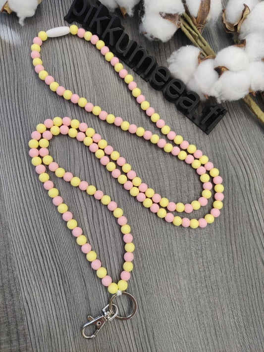 Avainnauha olan yli (vaaleankeltainen / vaaleanpunainen) - pikkumeea