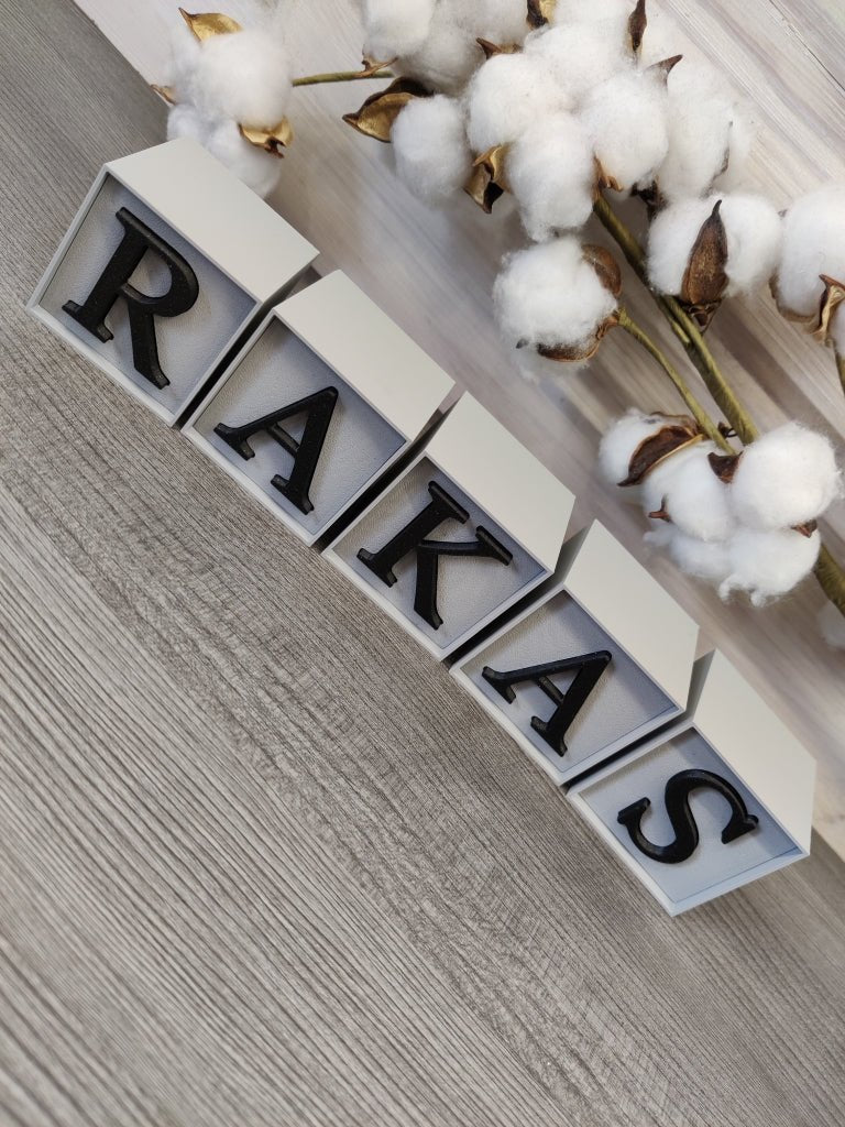 Kirjainkuutiot "RAKAS" (harmaa / kimaltava musta) - pikkumeea