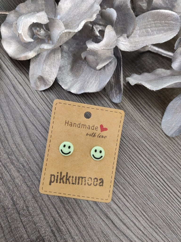 Nappikorvakorut Pimeässä hohtava smile (vaaleanvihreä / musta) - pikkumeea