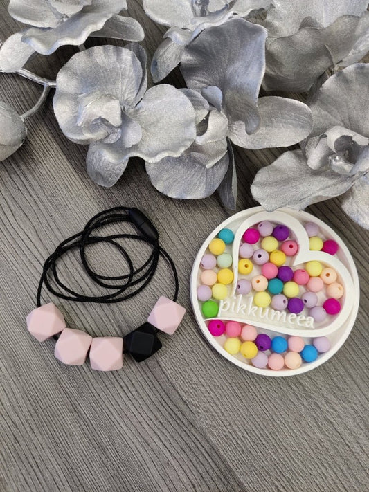 Imetys - /kantokoru (vaaleanpunainen / musta) - pikkumeea